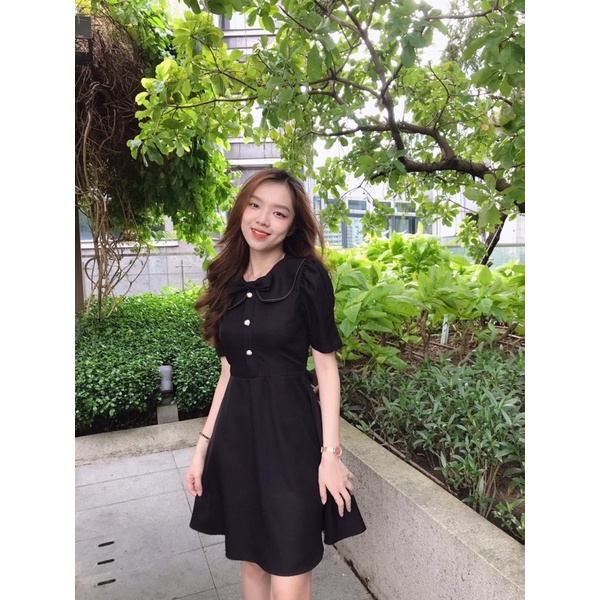 Đầm nơ viền chỉ