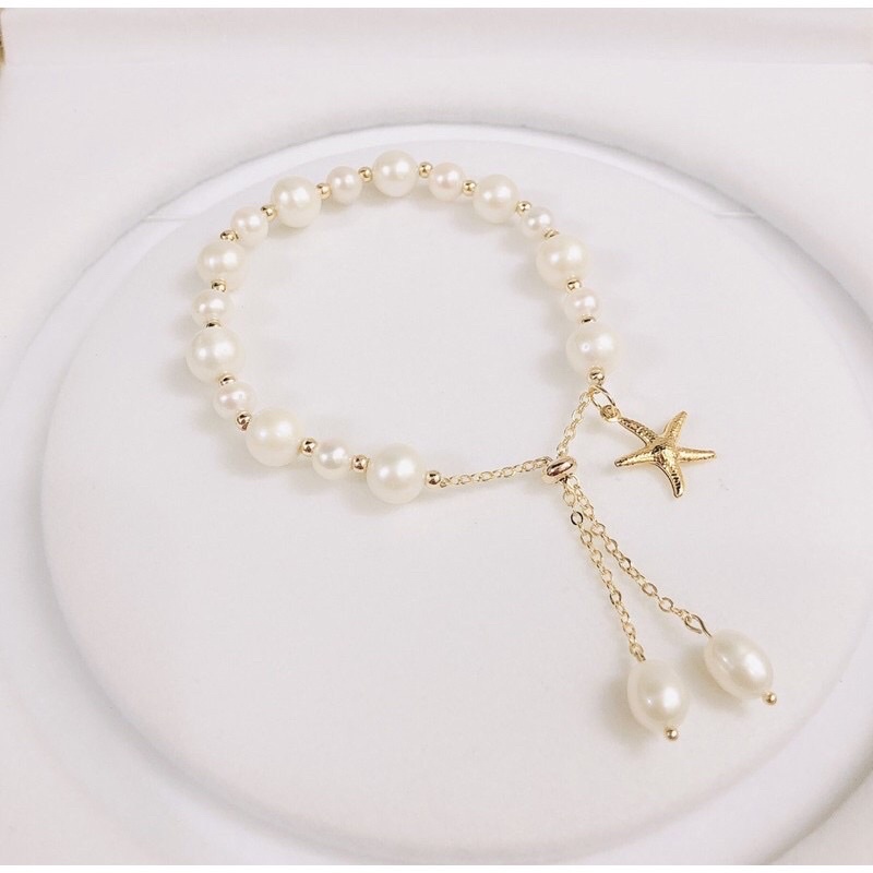 Vòng tay hạt ngọc trai nhân tạo 8ly mix charm sao biển