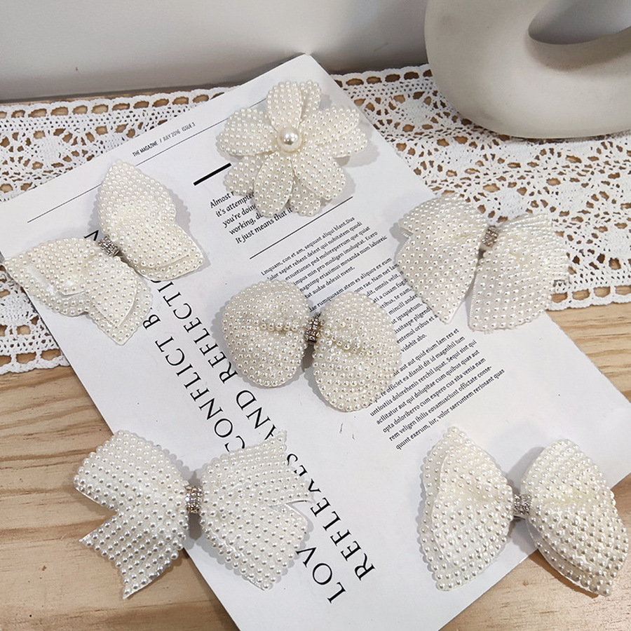 Kẹp tóc trang trí nơ nơ đính hạt ngọc trai phong cách Hàn Quốc