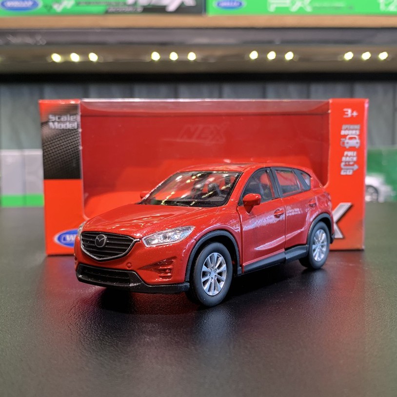 Mô hình xe ô tô Mazda Cx5  tỉ lệ 1:36 hãng Welly màu đỏ