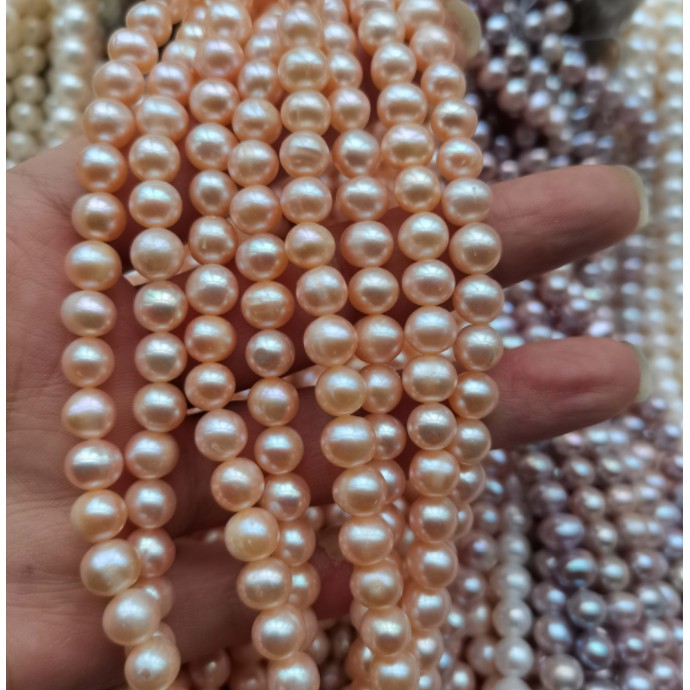 Dây nguyên liệu màu hồng cam 6-7mm gần tròn độ sáng 3A