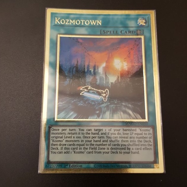 Lá bài Kozmotown - MAGO-EN050 - Premium Gold Rare 1st Edition