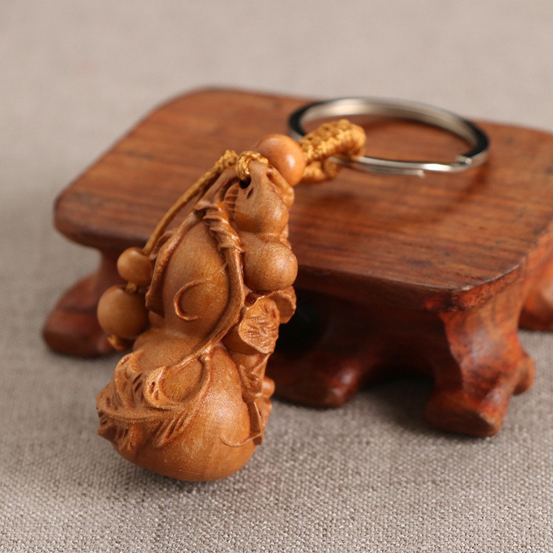 Sỉ 100 móc khóa gỗ hồ lô phong thủy may mắn bình an