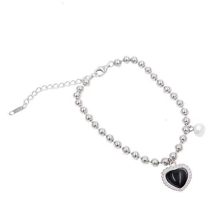 Vòng tay bằng thép titan màu đen đính ngọc trai nhân tạo phong cách cổ điển thời trang cho nữ