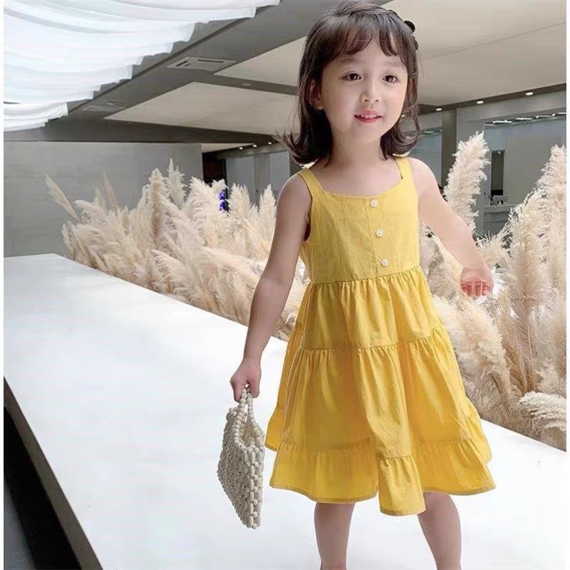 Váy vàng cam xoè tầng cho bé gái