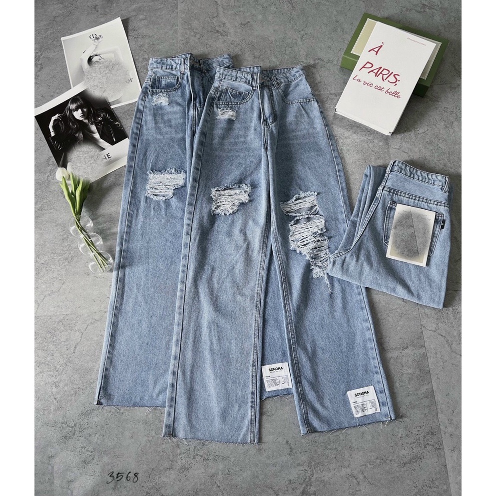 QUẦN JEANS ỐNG RỘNG NỮ LƯNG CAO RÁCH MẢNG ĐÙI PHẢI 2 MẢNG ĐÙI TRÁI PHỐI MẠC TRẮNG GẤU, LAI TUA MÀU XANH NHAT