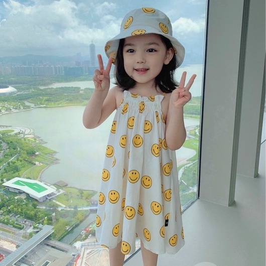 Váy bé gái 2 dây ICON mặt cười xinh xỉu đi biển kèm mũ đội đầu