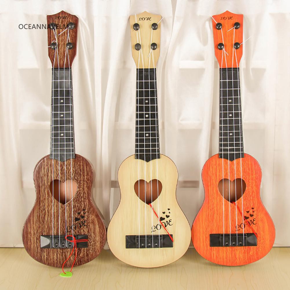 Đàn ghi ta ukulele mini bốn dây phong cách cổ điển dùng dạy học âm nhạc cho bé