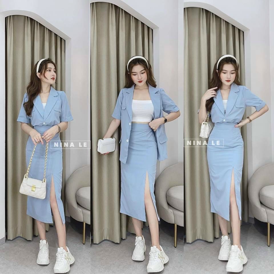 Sét váy nữ lót trong kèm áo khoác ngoài kiểu vest tay ngắn phối nút, mix chân váy ôm body xẻ tà cho nàng công sở