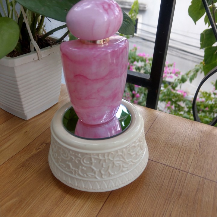 Đế xoay có led dây cót xoay phát nhạc - DX010