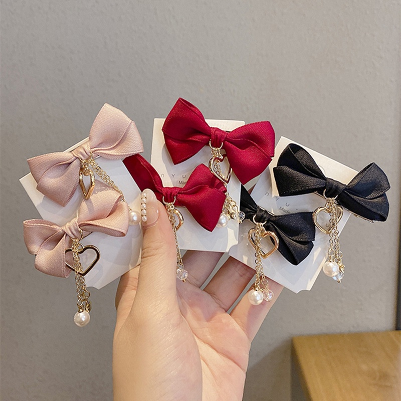 ✨✨Set 2 Kẹp Tóc Nơ Tua Rua Đính Ngọc Trai Giả Mừng Năm Mới