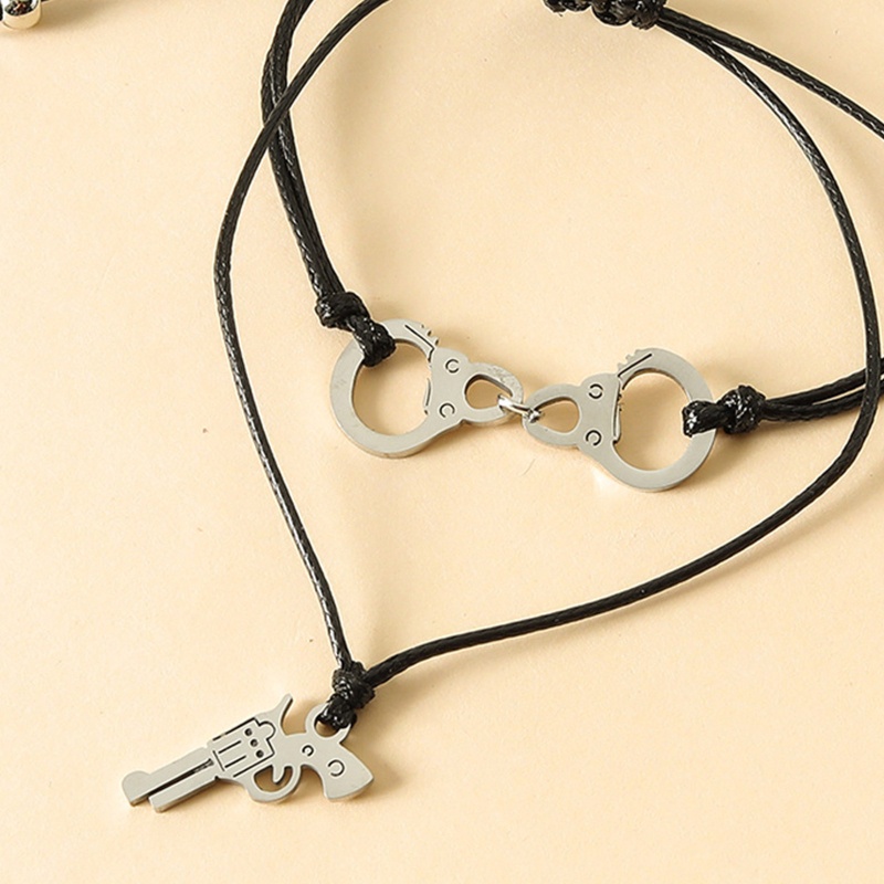 Vòng Cổ Choker Bằng Thép Không Gỉ Hình Còng Tay Và Súng Lục Độc Đáo