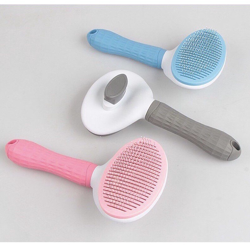 Lược nhựa chải lông nút bấm tự làm sạch