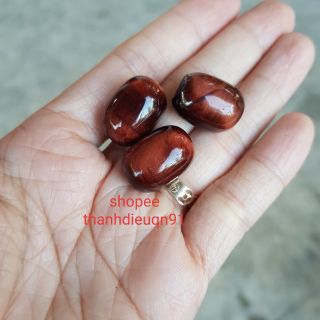 Lu thống màu đỏ m.hổ có lỗ xuyên tâm 2.5 li kèm dây đeo cổ