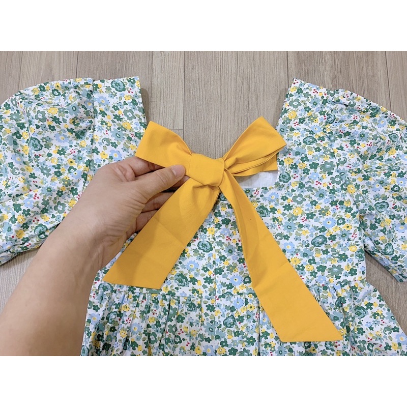 Đầm Melisa hoa nhí nơ vàng cho bé gái siêu xinh