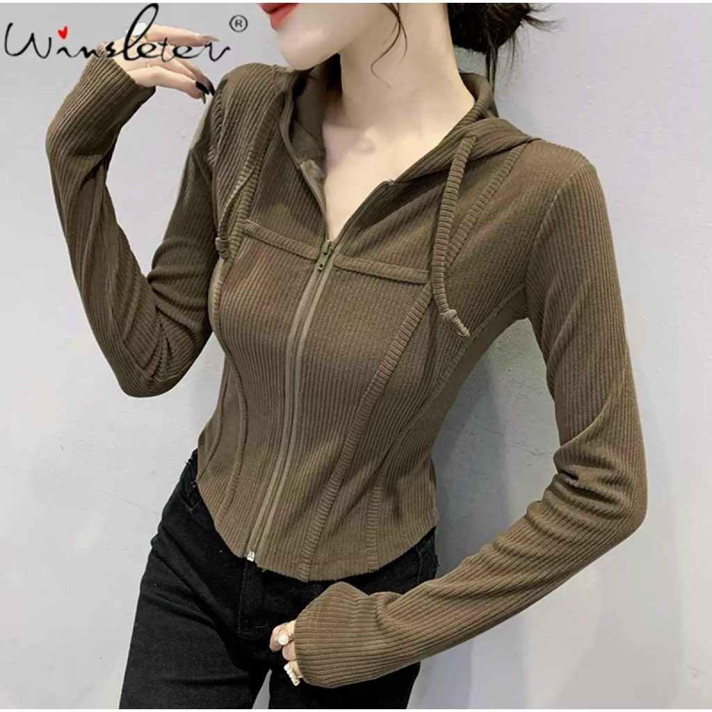 Áo kiểu có nón tay dài viền chỉ gân dây kéo giữa cực xinh , chất thun gân