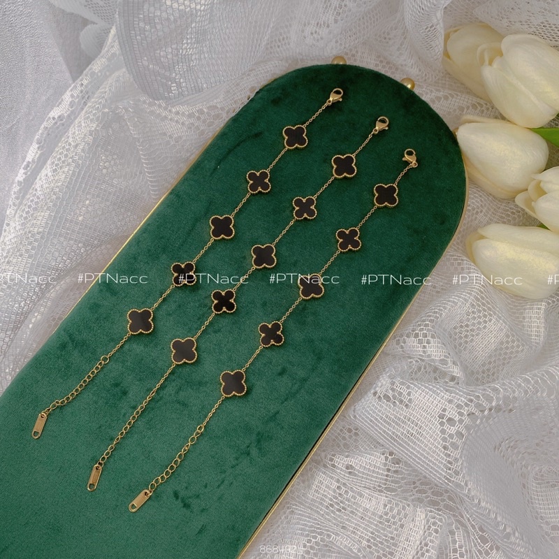 Lắc tay titan cỏ 4 lá, 2 mặt màu đen xen kẽ mặt đính soàn .PTNACC.