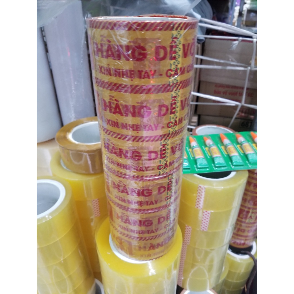 Băng dính loại 1kg 0.5kg lõi nhựa 2.4mm, băng dính đóng hàng, băng dính hàng dễ vỡ xin nhẹ tay