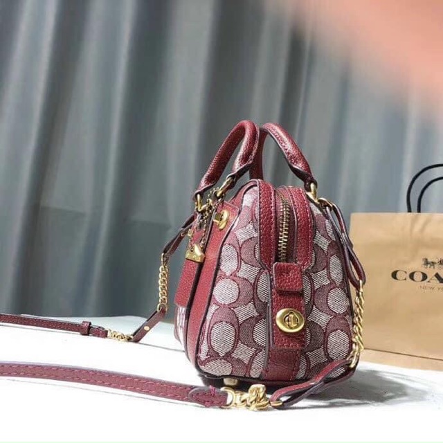 Túi Coach mini dáng trống dư xịn