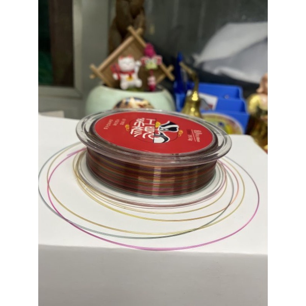 cước quỷ vương 7 màu 100m tàng hình dưới nước, chất liệu polyme nên sợi dai và chắc, tải cá cao, chống rối và xoắn