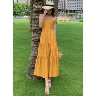 Maxi freesize đi biển vàng đan dây sau