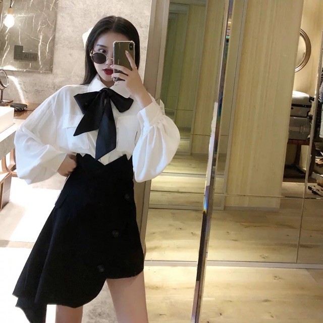 Áo sơ mi dài tay phối chân váy vạt lệch kèm nơ đen trắng