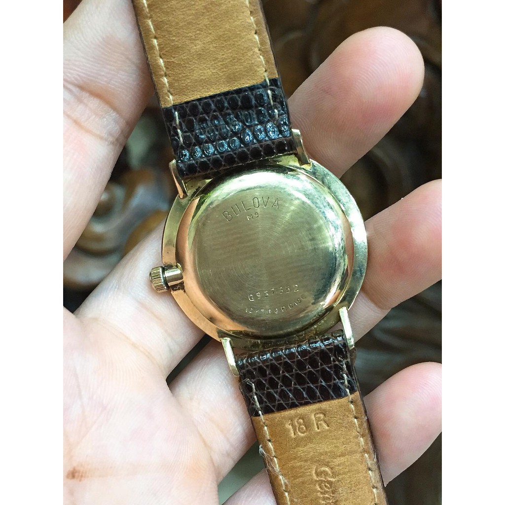 Đồng hồ nữ Bulova Cơ cót lắc kê vàng, mặt mỏng, dây da cá sấu