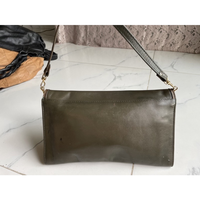 Ví cầm tay si của Pháp da mộc Ted Lapidus Paris