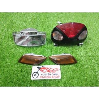 Xi nhan pha đèn hậu satria 2000