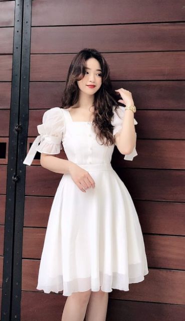 Váy trắng tay bồng đính nơ tiểu thư
