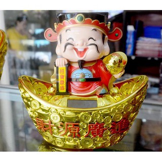 Ông thần tài ngồi thỏi vàng