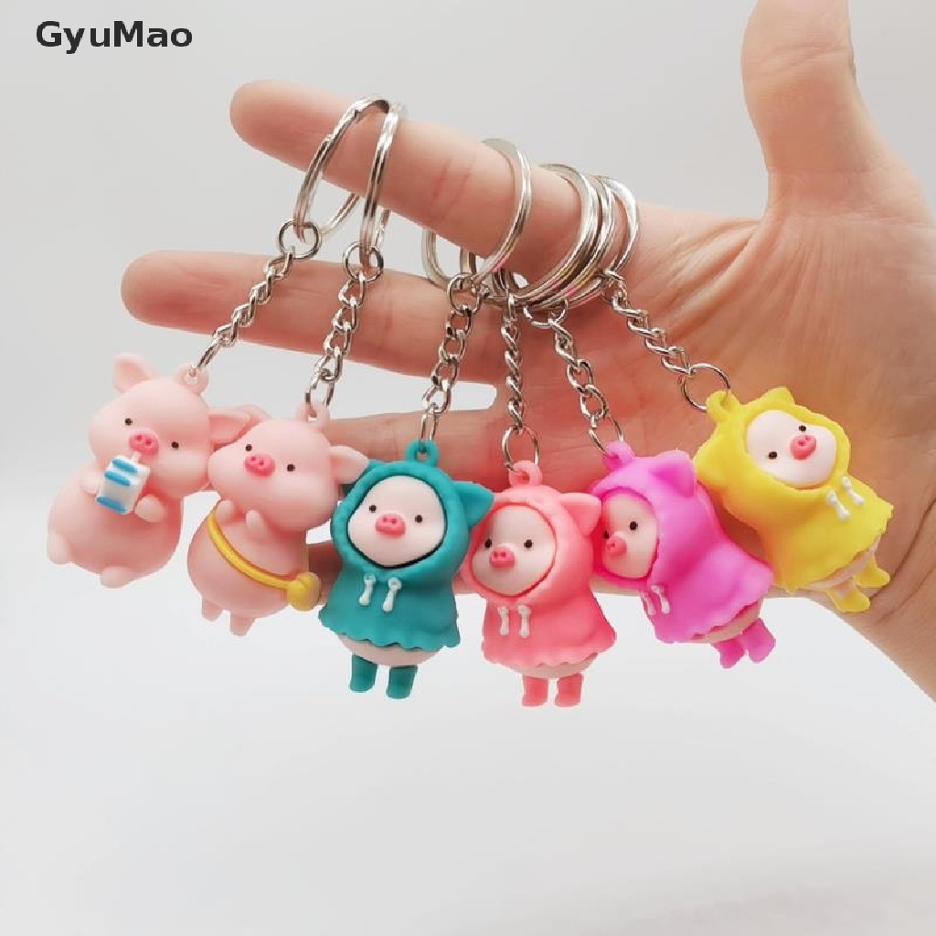 Móc khóa gắn hình chú heo con mặc áo mưa dễ thương