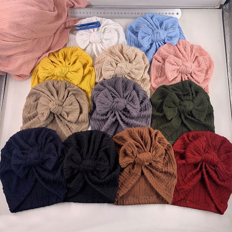 Mũ beanie cotton mềm màu trơn đính nơ dễ thương cho bé sơ sinh