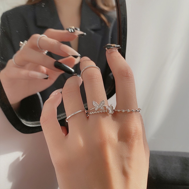Bộ 4 Nhẫn Hình Cánh Bướm Xoắn Đôi Màu Bạc Thời Trang Cho Nữ