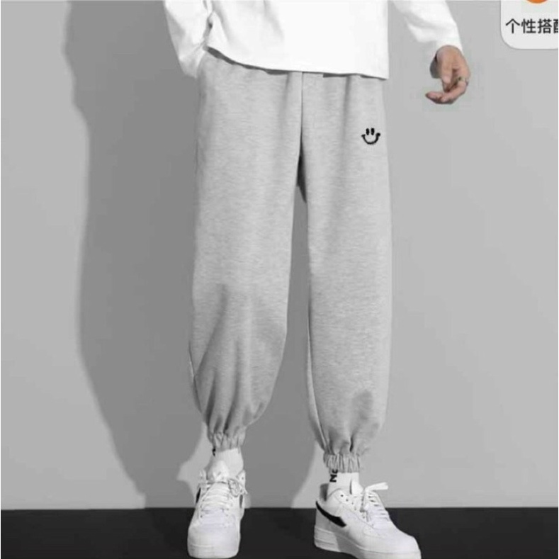 Quần Nỉ Unisex Mặt Cười Lưng Thun Ống Bó Chun