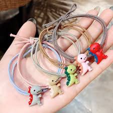 Combo 3 dây buộc tóc hoa cúc, khủng long