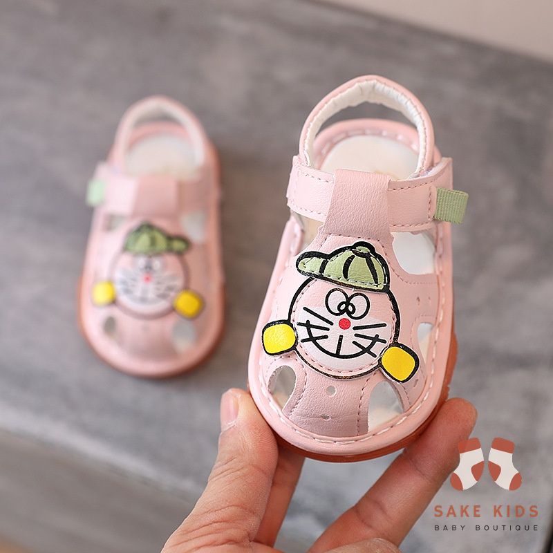 Sandal tập đi bé trai bé gái - Dép rọ có còi hình Đoremon dễ thương chống trơn trượt cho bé từ 0-1 tuổi M301