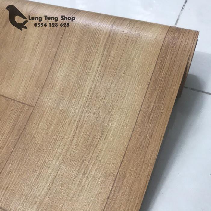Thảm nhựa simili trải sàn vân gỗ màu vàng bề mặt nhám