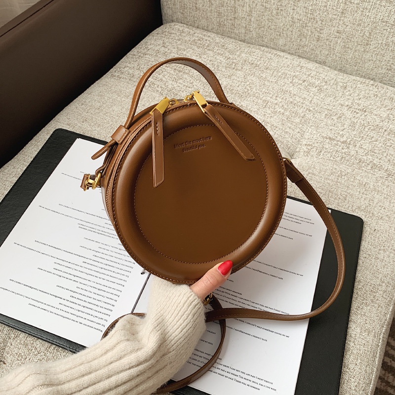 Korean niche design round cake simple retro handbag one shoulder under the bag women's apple small round bag