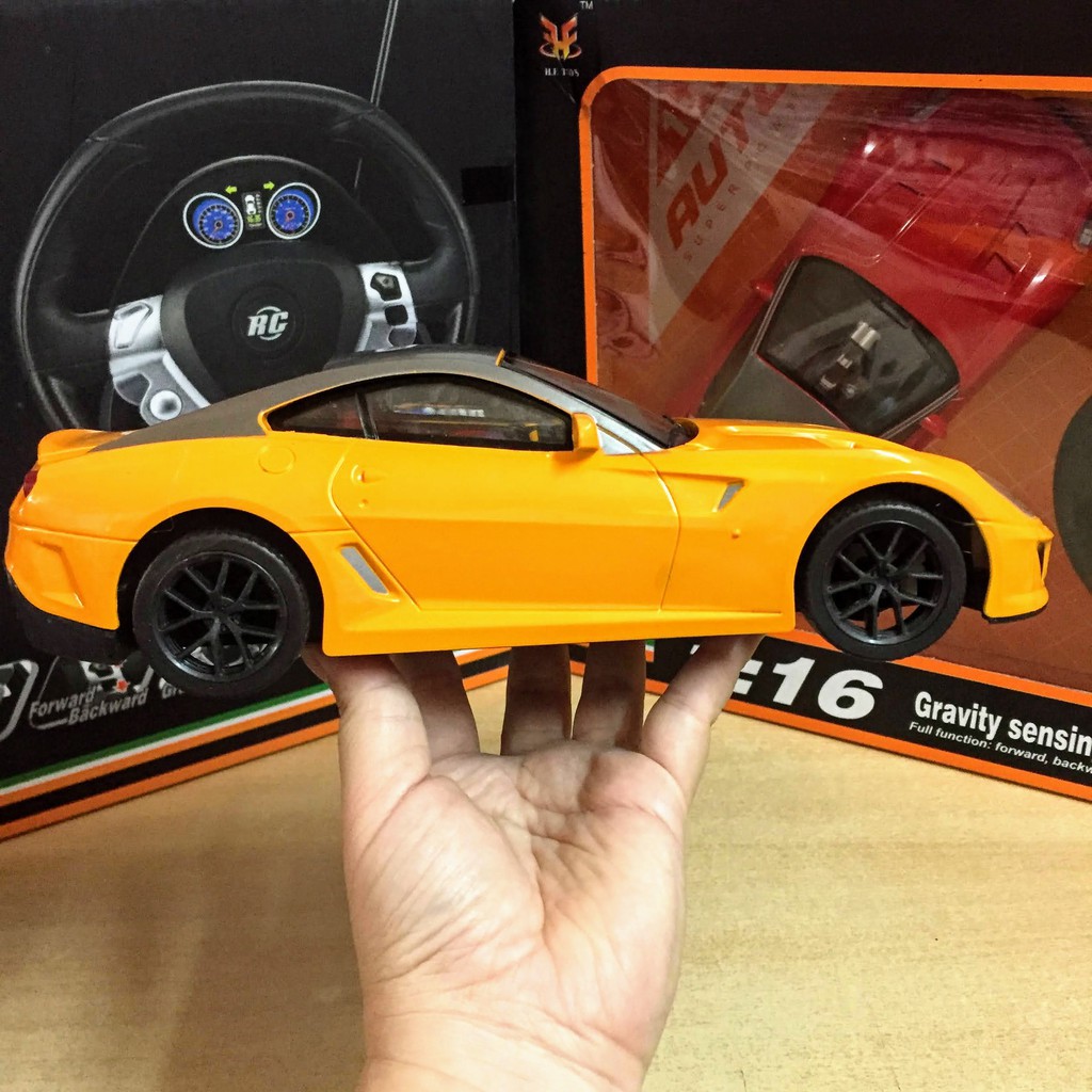 Xe ô tô điều khiển từ xa bằng vô lăng tỉ lên 1:16 của H.E Toys dành cho bé 3 tuổi trở lên