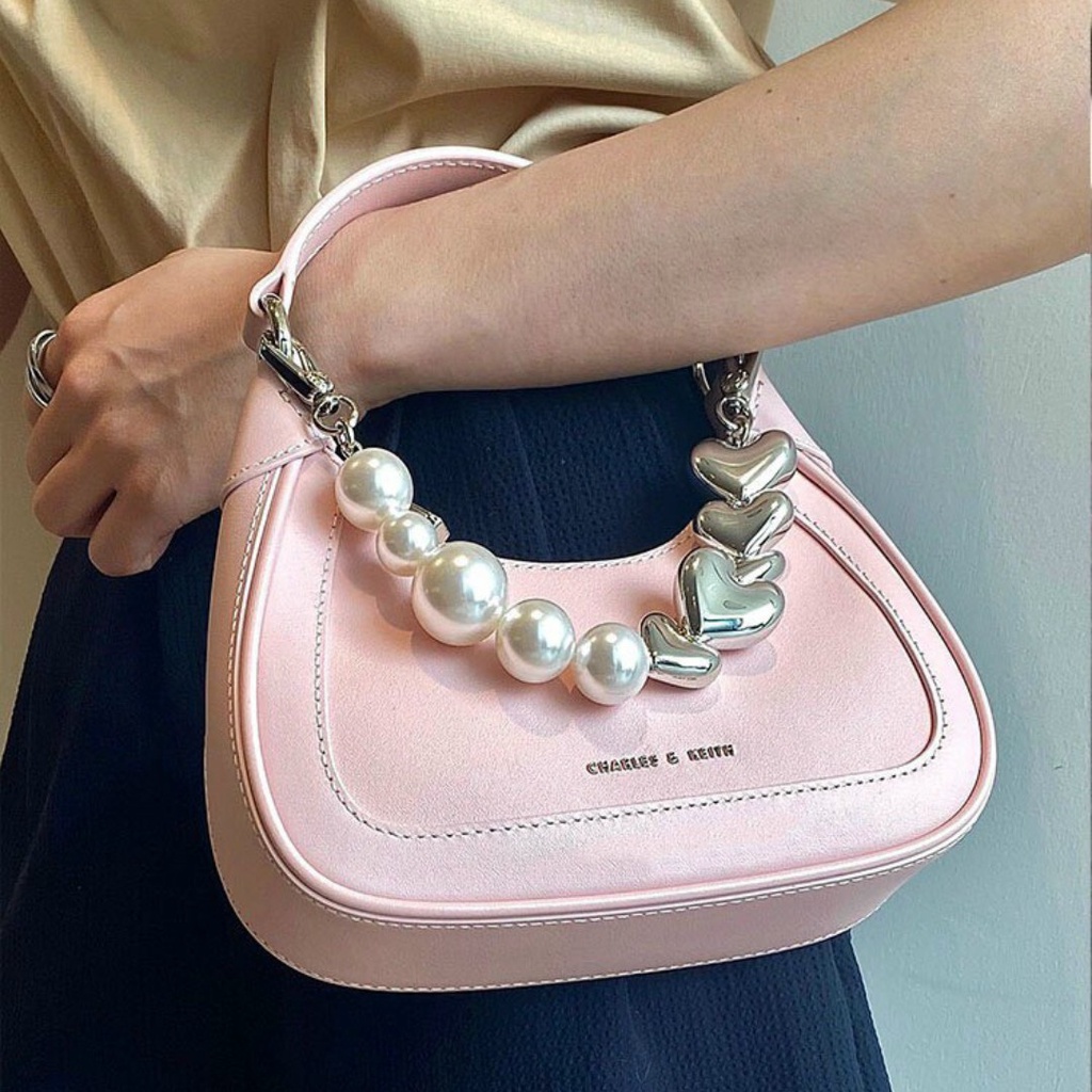 Túi cầm tay CnK màu hồng phối dây đeo hình trái tim và ngọc trai nhân tạo fullbox làm quà
