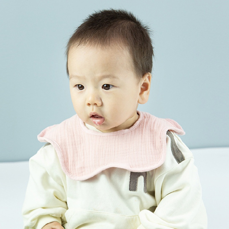 Yếm đeo cổ vải cotton màu trơn hình hoa xoay 360 độ thoáng khí tiện dụng cho bé
