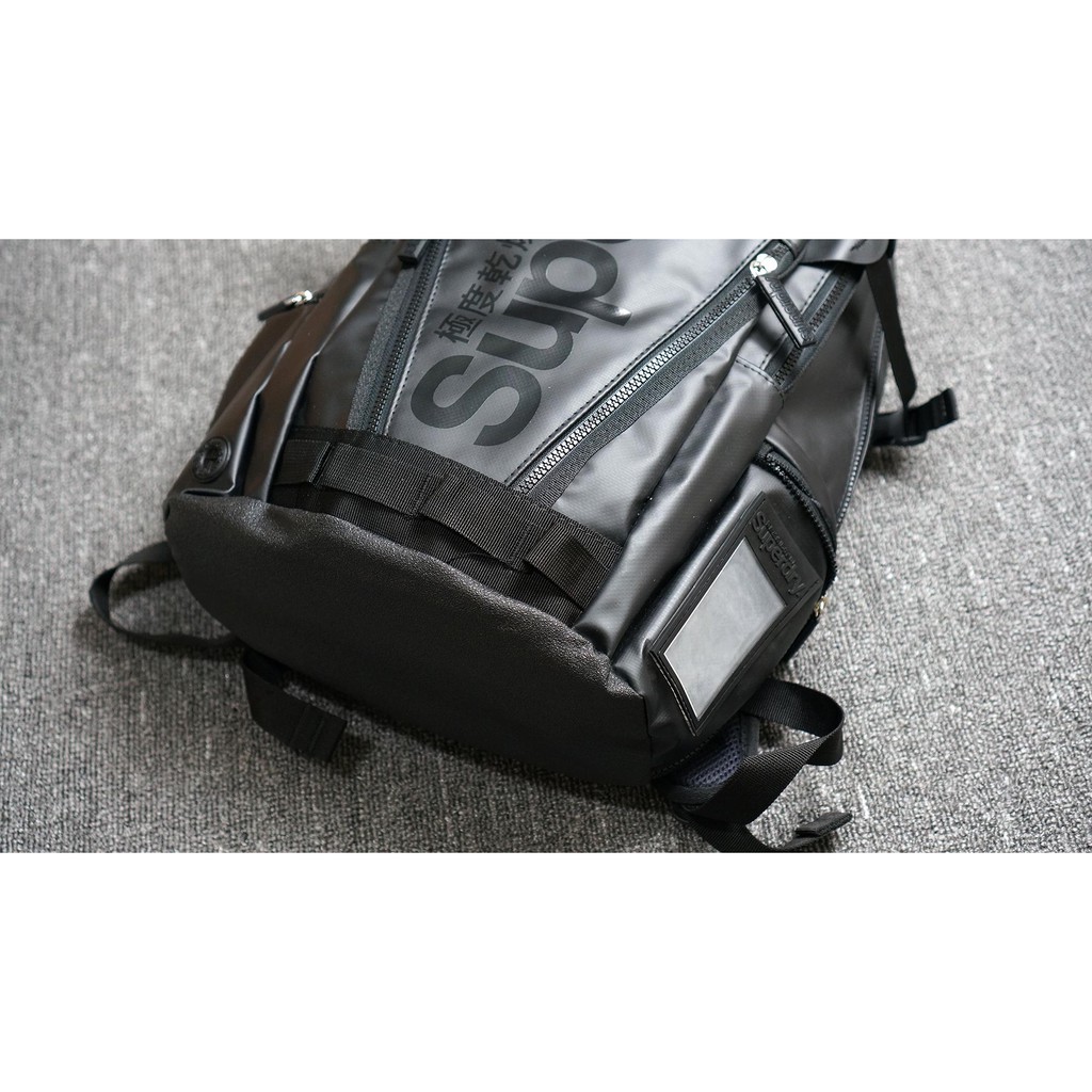 Balo Chống Thấm Nước Superdry Tarpaulin Classic Màu đen/ Đen chữ cam