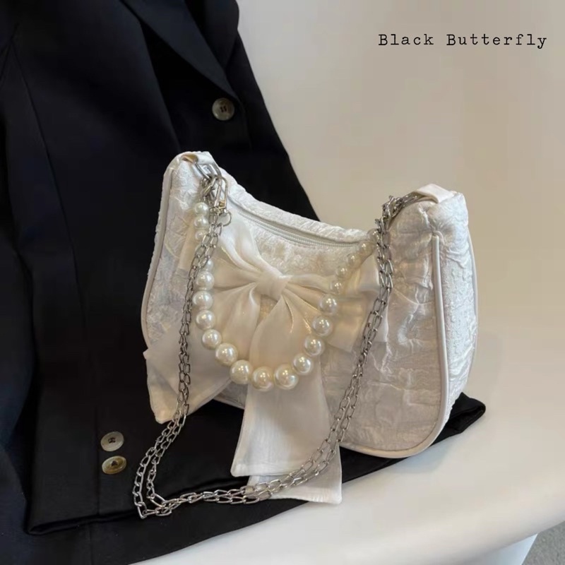 Túi đeo chéo đính nơ vải sần Butterfly