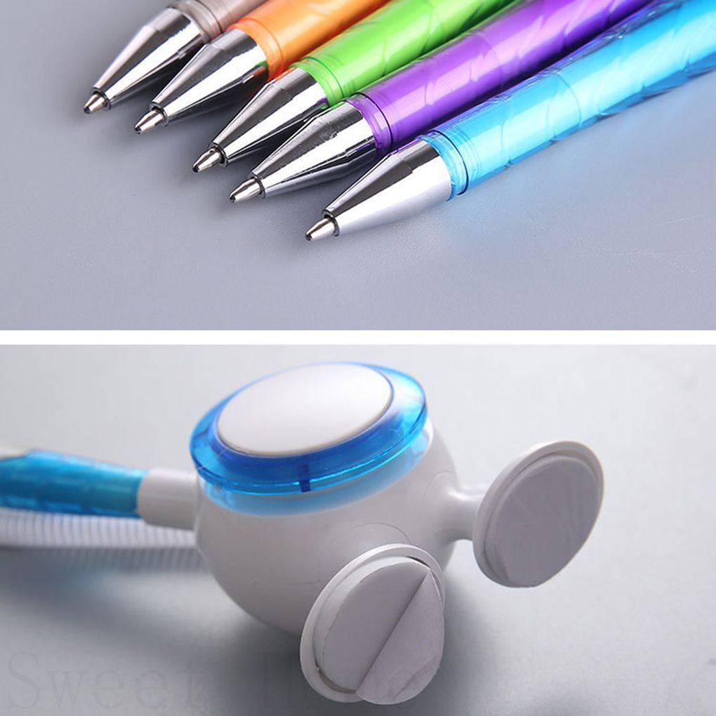 Cây bút bi và giá đỡ tự dính dùng ở bàn tiếp tân tiện lợi