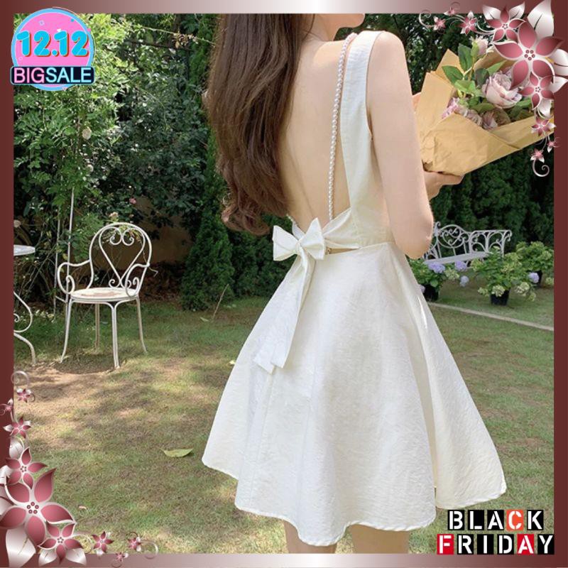 Đầm trắng hở lưng cột nơ dây chuỗi nhẹ nhàng xinh xắn | BigBuy360 - bigbuy360.vn