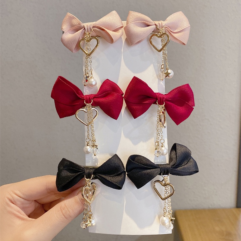 ✨✨Set 2 Kẹp Tóc Nơ Tua Rua Đính Ngọc Trai Giả Mừng Năm Mới