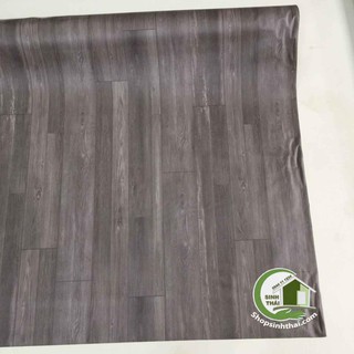 Simili trải sàn vân gỗ màu xám đậm ,  bề mặt có vân nhám như gỗ thật.