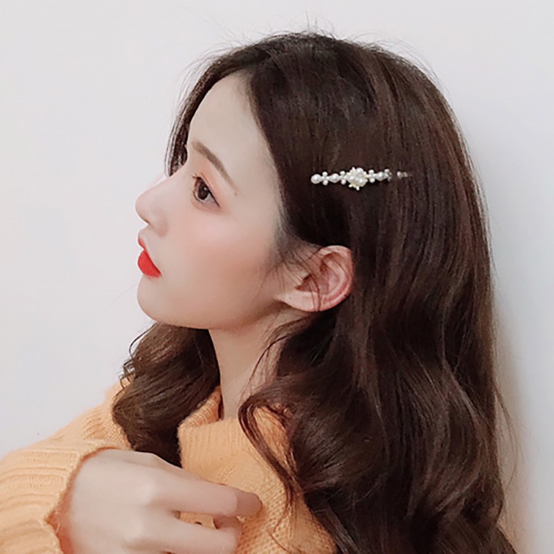 Kẹp tóc hình trái tim và ngọc trai