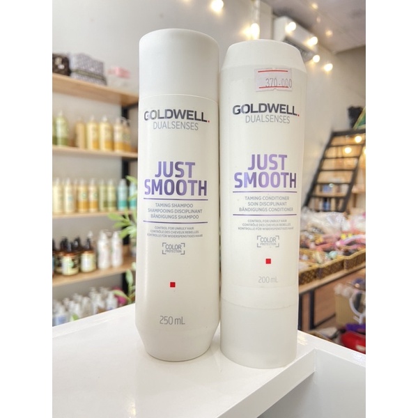 Dầu Gội Xả Suôn Mượt Goldwell Smooth Giúp chăm sóc tóc tóc xơ rối khó vào nếp, phù hợp với các loại tóc khô xơ hư tổn